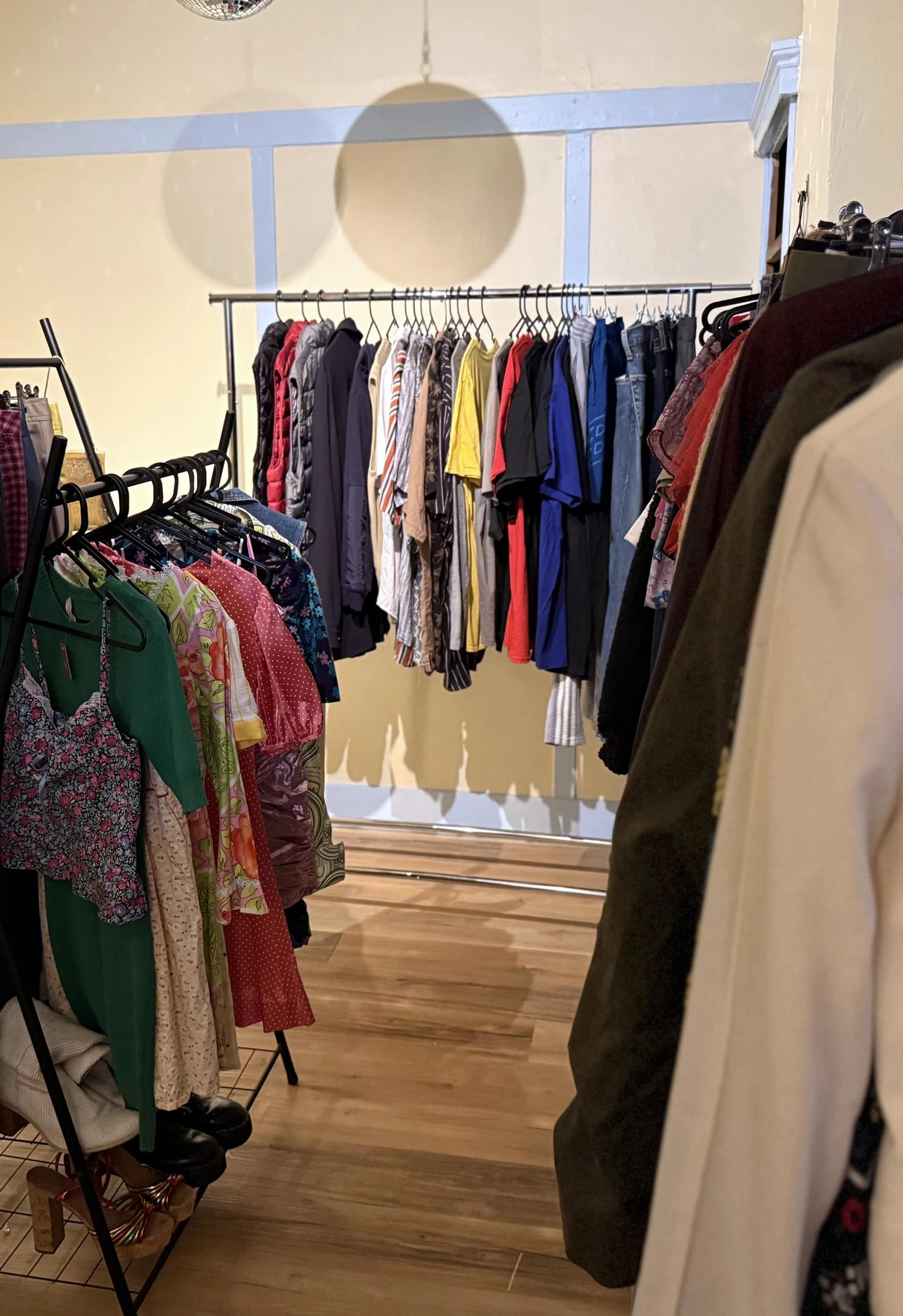 Secondhand clothes on racks in the Bar Lou Lou thrift shop