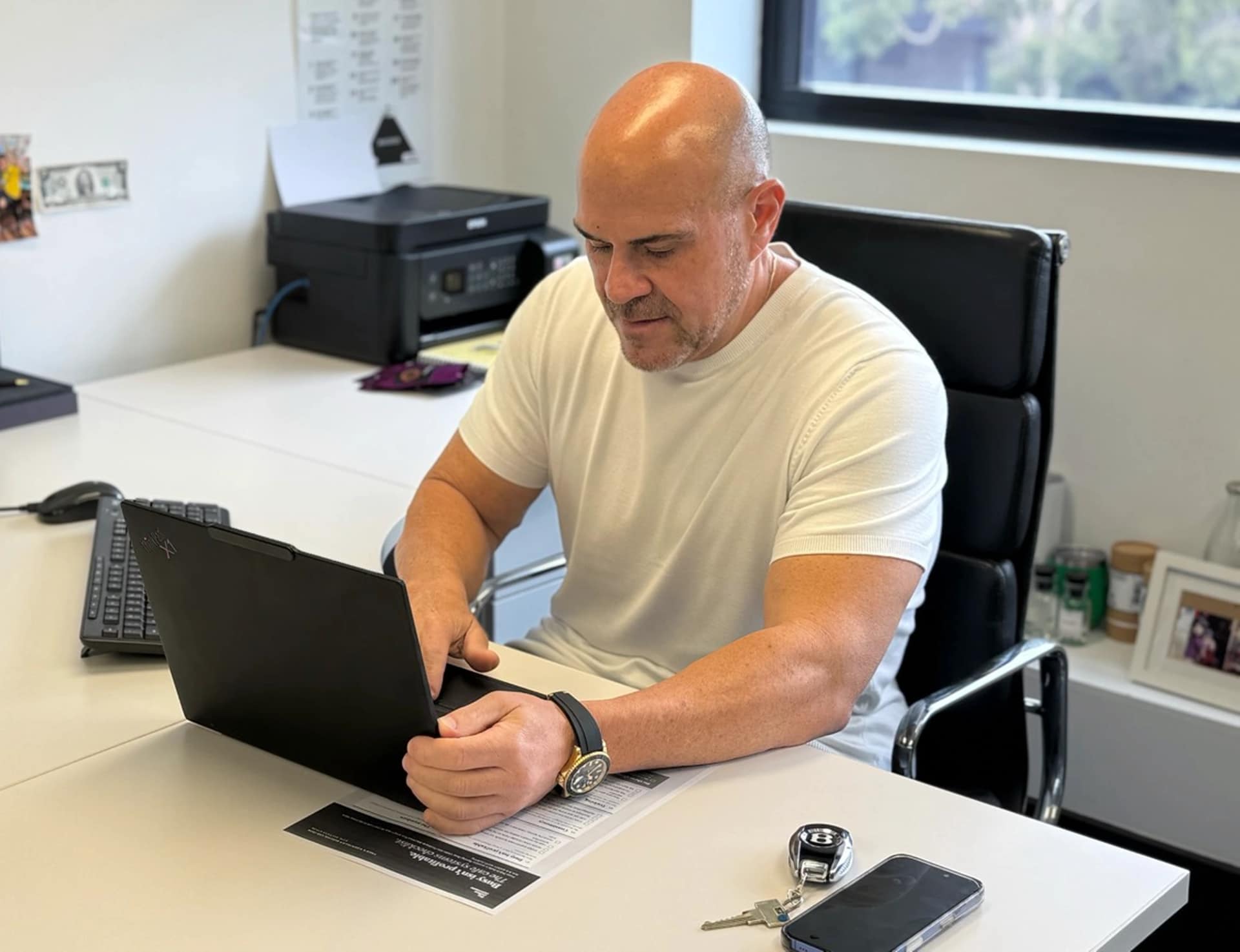 Phillip Di Bella working on his laptop at his desk