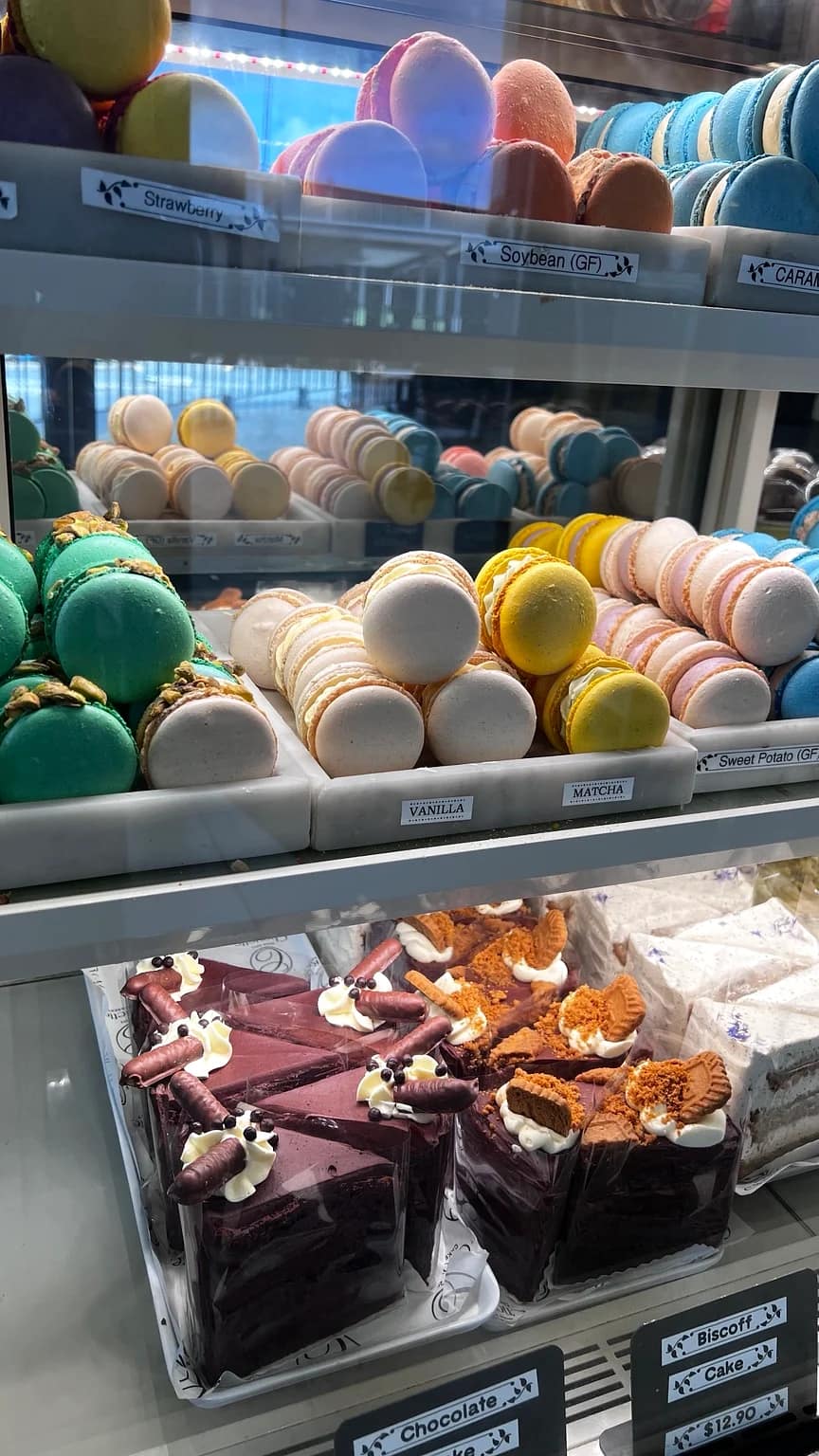 Macarons and cakes displayed at Chouette Cake and Dessert in Underwood