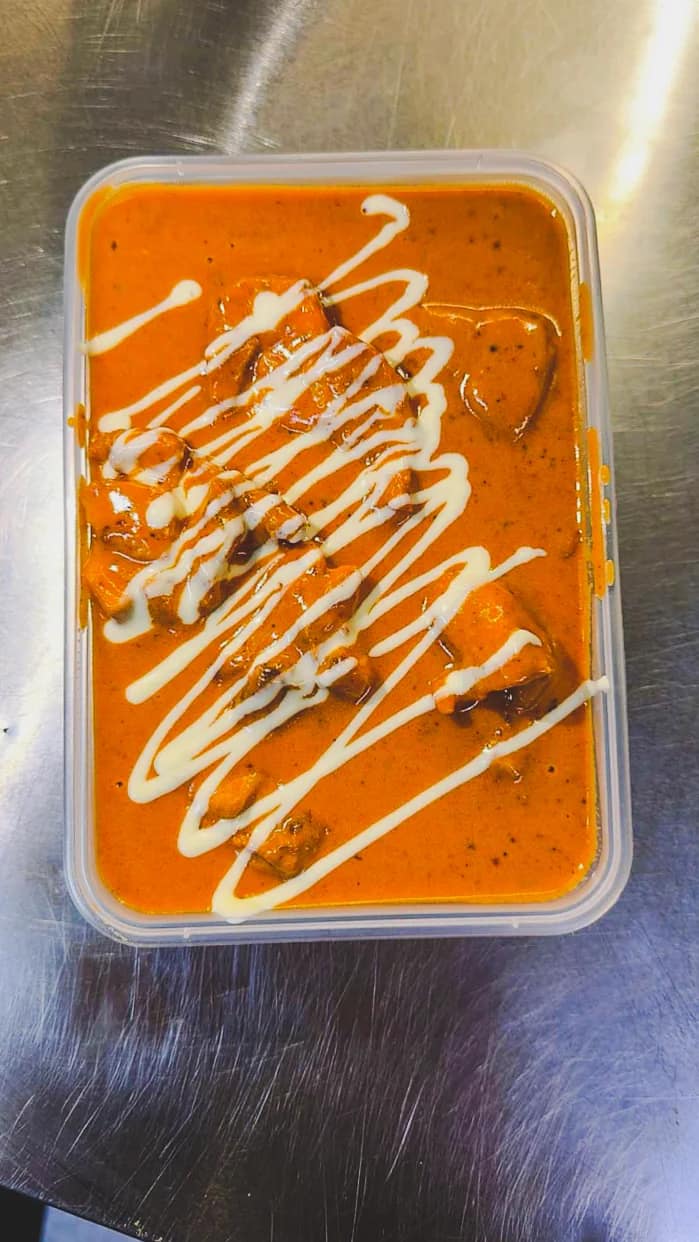 Butter chicken prepared by Punjabi Bytes
