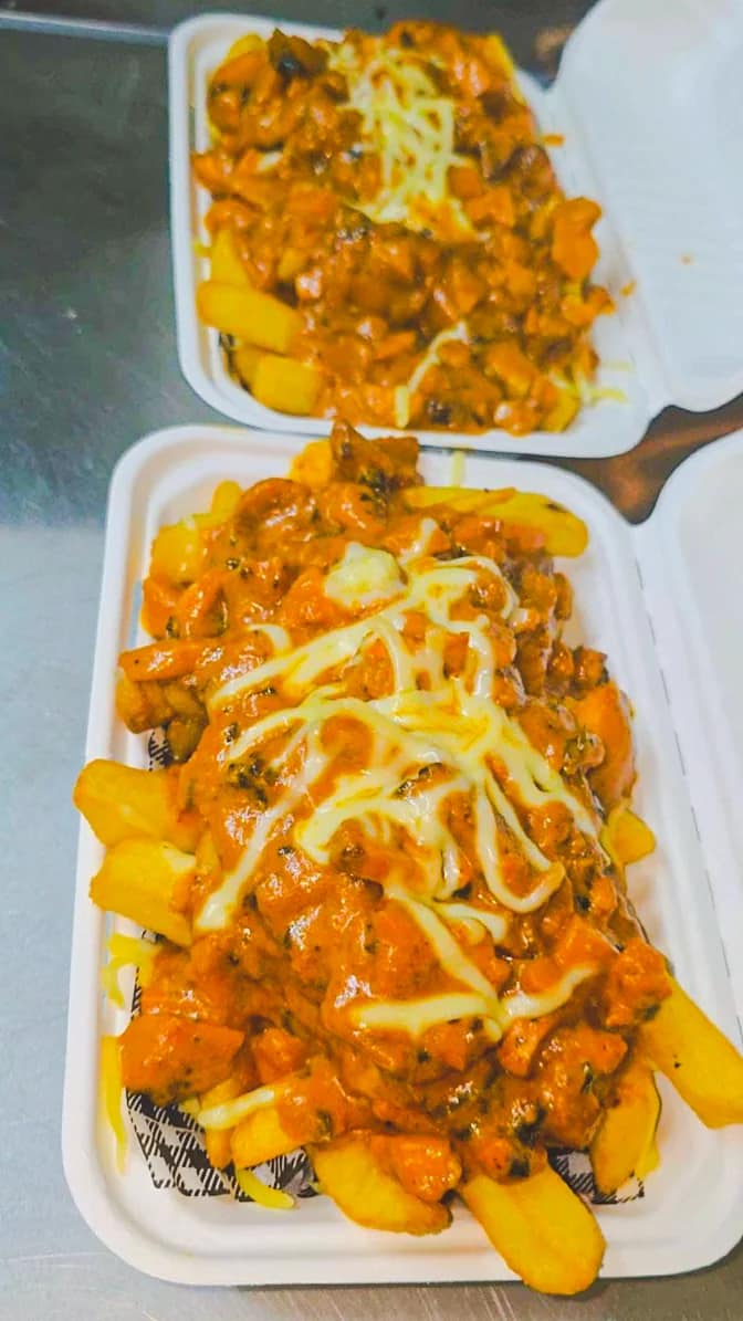 Two serves of Punjabi loaded fries prepared at Punjabi Bytes