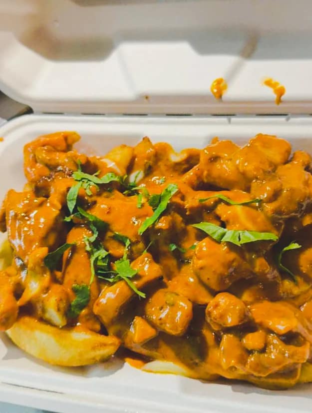 Punjabi loaded fries finished with curry and cheese at Punjabi Bytes