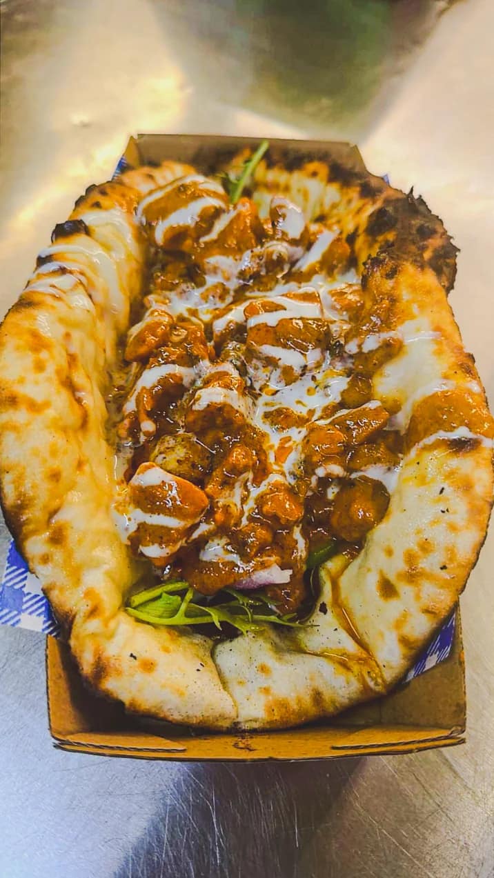 Cheesy naan taco filled with Punjabi curry at Punjabi Bytes