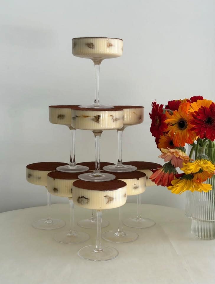 A tower of tiramisu served in coupe glasses by The Crema Room
