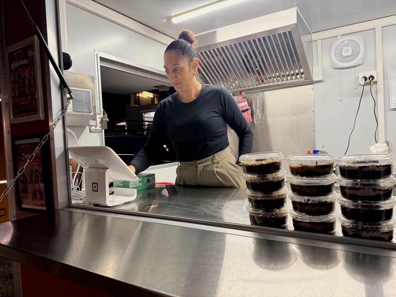 Vanilla Bar founder Dixie working behind the dessert counter in Woodridge