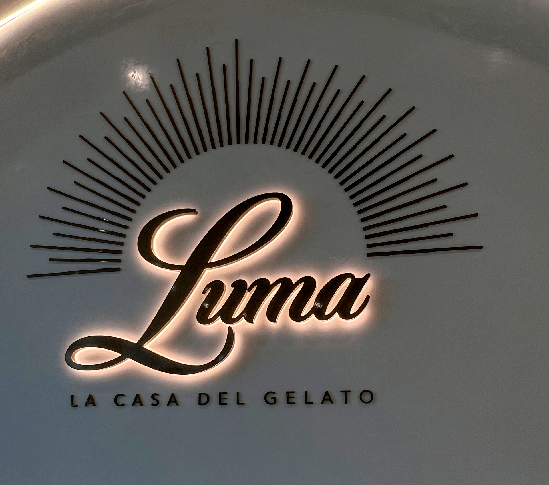 The illuminated Luma La Casa del Gelato sign mounted on the Newstead shop's wall