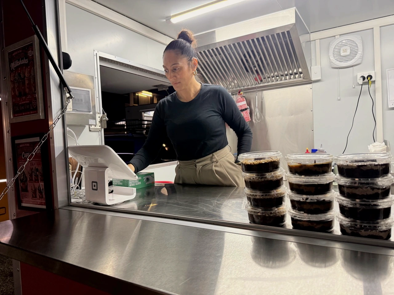 Vanilla Bar founder Dixie working behind the dessert counter in Woodridge