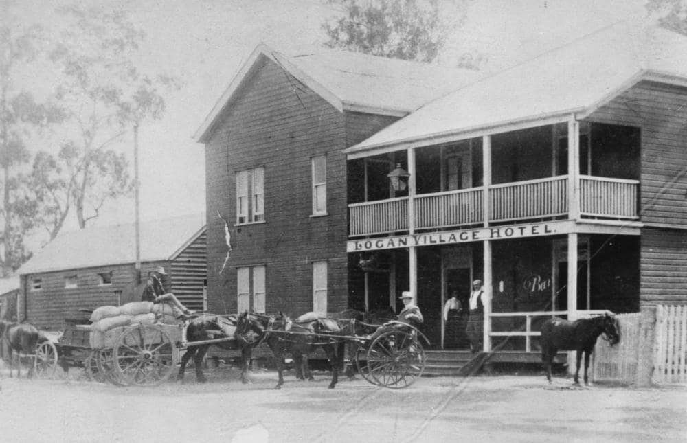 Logan Village Hotel with people, horses and carts outside around 1912