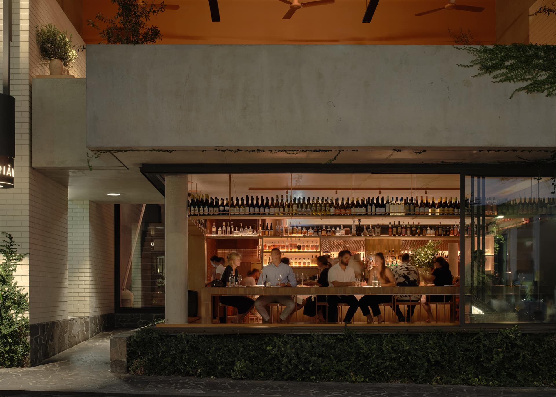 Biànca’s open frontage and warmly lit dining room in the evening
