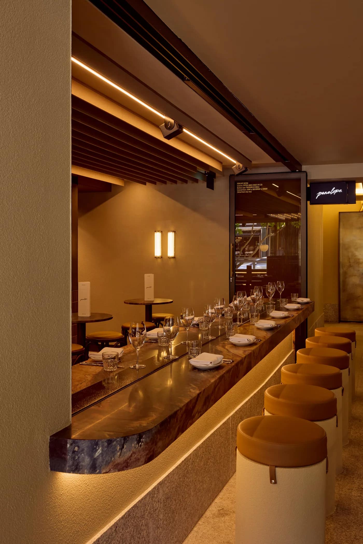 The long marble bar and dining counter inside Penelope on James Street