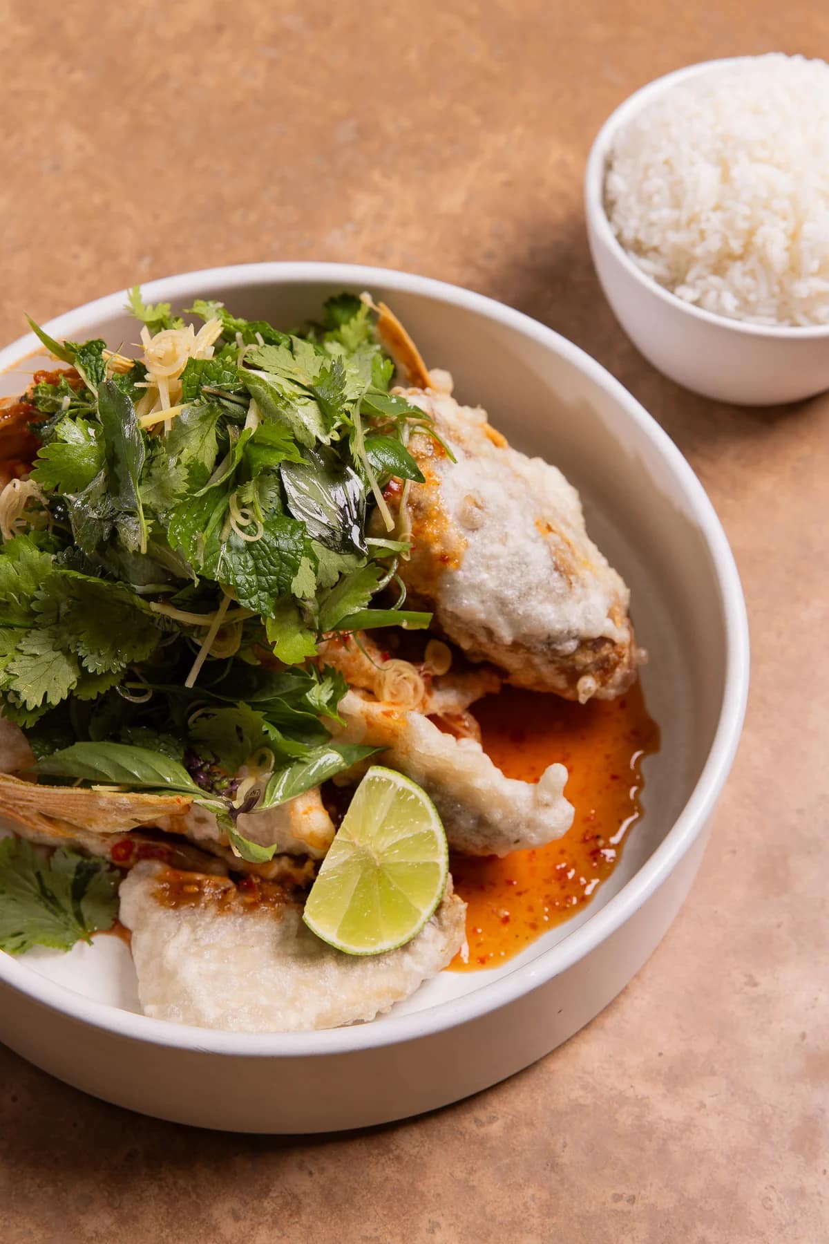 A Thai dish served with herbs, lime and rice at sAme sAme