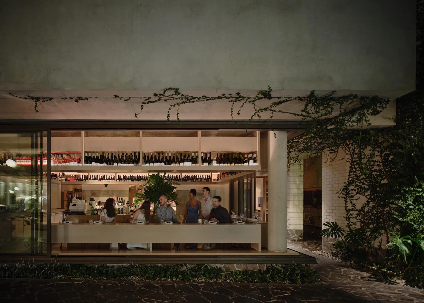 The open kitchen at sAme sAme seen from Ada Lane at night