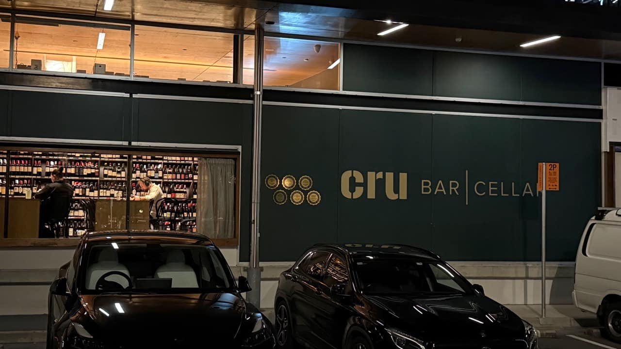 CRU Bar and Cellar frontage on James Street at night, photographed by Brisbane Food Guide
