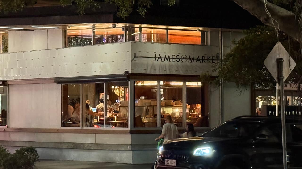 Warmly lit dining rooms at James St Market at night