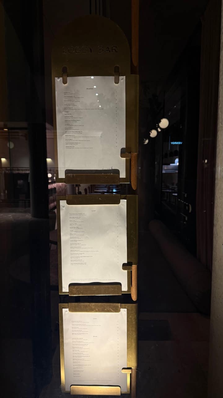 Lobby Bar menus displayed at The Calile Hotel entrance